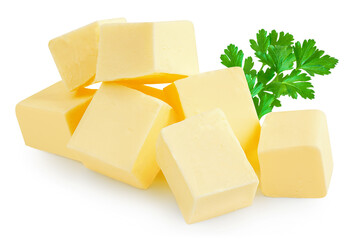  Butter cubes isolated on white. Fresh cow’s milk butter pieces with parsley close up. Pile of butter.  