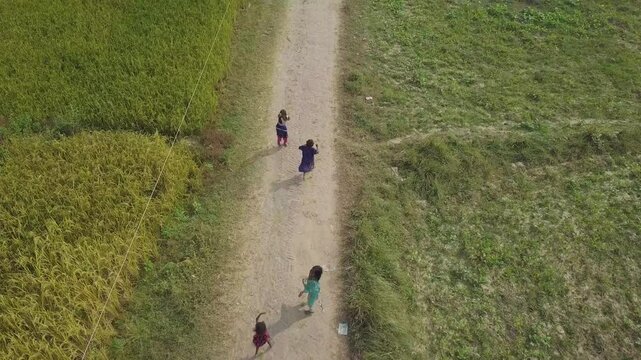 A scene of people walking along a road in Bihar, India.