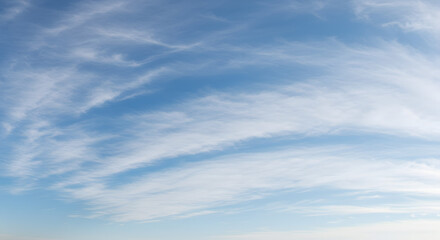 blue sky and clouds. Aerial View of Bright Blue Sky, White Cumulus Clouds, and Sun Flare Over Horizon.