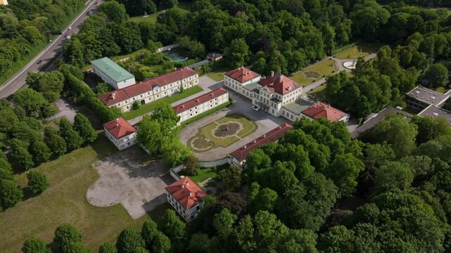 Aerial view of Fuerstenried Palace in Munich. Baroque architecture, lush gardens and summer sunlight reveal Bavaria noble heritage in cinematic drone footage. Luftbild von Schloss und Schlosspark. 