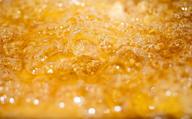 Close up bright orange Oil or beer splash texture and nature waves, Beautiful waves curve and...