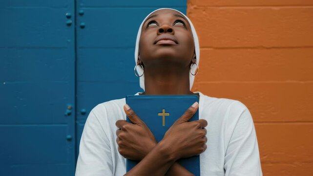 African american woman holding bible with cross, praying for God's help, hope and faith, for religious gathering, faith based programs, community support	