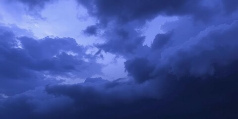 Vast, brooding sky; deep blues and purples dominate, leaving ample negative space,  feeling,  tranquil