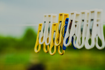 Clothespins Wait on a Line Under a Cloudy Sky in a Rural Setting During the Afternoon Hours
