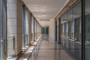 Extension of modern minimalist corridor in an empty shopping mall