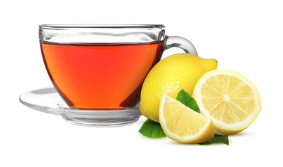 Tea in glass cup and fresh lemons on white background