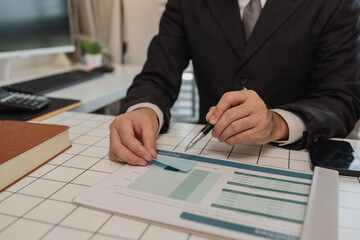 a businessman is sitting at work in his private office, an employee is handling documents to finish on time, accountant, finance, statistics documents, professional, workplace