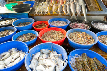 Fish market in Kochi India, market stall with freshly caught seafood, fishing industry at the Arabian Sea