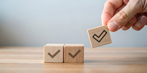 Hand placing wooden block with check mark completing a row of task completion checklist