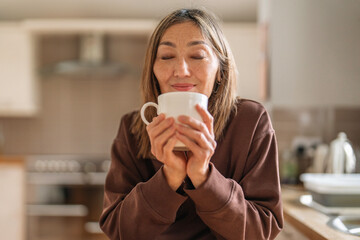 Enjoying a warm cup of coffee in a cozy kitchen during a peaceful morning