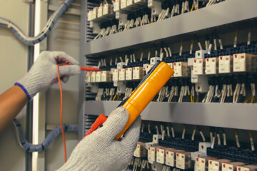 Technicians use multimeter to test or diagnose electrical control devices.