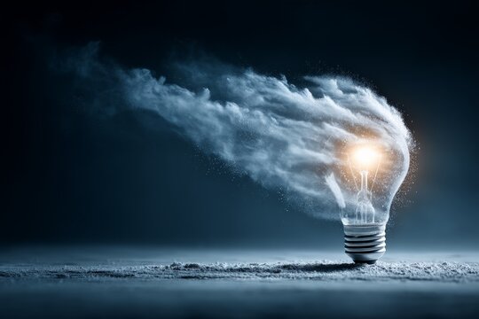 Creative representation of energy emanating from a light bulb in a dark environment with smoke and glow