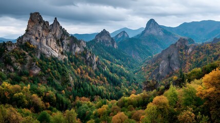 Majestic Mountain Landscape with Autumn Forest and Dramatic Sky