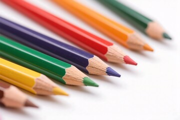 Fototapeta premium Colorful pencils arranged diagonally against white background promoting creativity and education