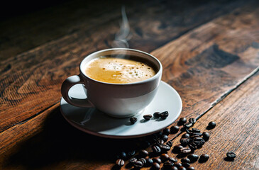 Coffee cup and coffee beans on wooden table, Espresso Crema coffee cup aromatic