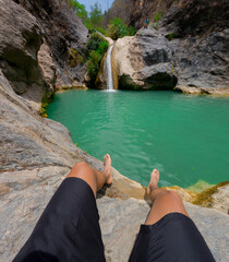 Tourist resting near waterfall in puebla, mexico