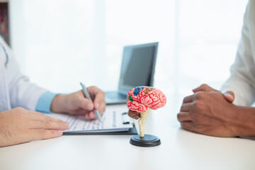 doctor is asking about patient information and symptoms to diagnose brain diseases before...