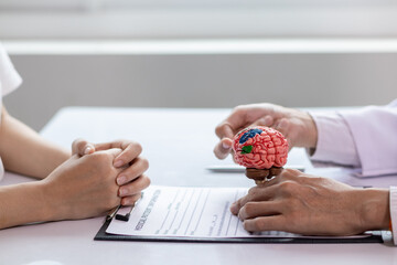 doctor is asking about patient information and symptoms to diagnose brain diseases before...