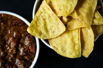 Bowls Of Mexican Beef Chilli Con Carne and Corn Tortilla Chips Sharing Food