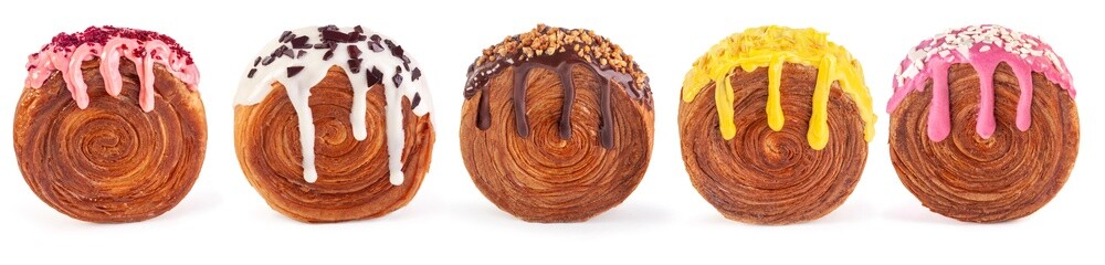 Creme-filled circular croissants with different filling and glaze. Round French or New-York Roll croissants isolated on white background