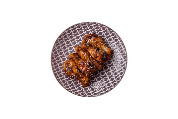Grilled chicken wings in teriyaki sauce. Hot spicy takeaway food