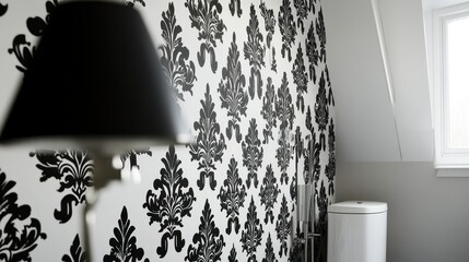 Black and white damask wallpaper adorns a room's wall.