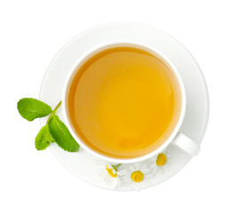 Delicious chamomile tea in cup, fresh flowers and mint isolated on white, top view