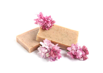 Soap bars and lilac flowers isolated white