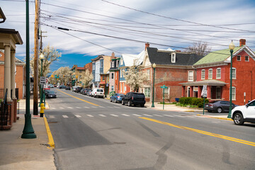 street in the historic town of Martinsburg, West Virginia. Ancient architecture of small multi-colored buildings in the colonial style.