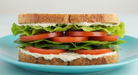 Making a Sandwich with Tomato and Lettuce on Whole Wheat Bread