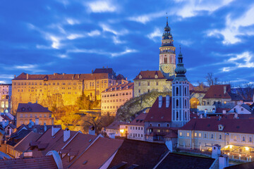 Fototapeta premium Historic buildings and tower at sunrise in Cesky Krumlov Czech Republic with morning light over the old town