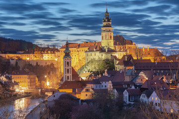 Obraz premium Historic buildings and tower at sunrise in Cesky Krumlov Czech Republic with morning light over the old town