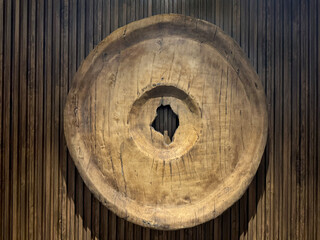 Hanging big circular artwork resembling old ancient coin or medallion shape. Rustic and weathered. Vintage and industrial concept. Suitable for wall decoration and accessories.