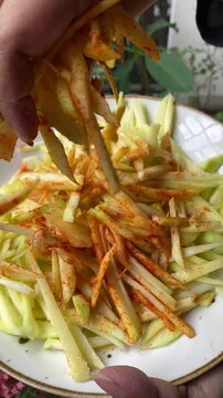 peeled mangoes in a bowl. Fresh sweet and sour fruits. Fresh raw green mango ready to be pickled or smashed. fresh young mango and leaf, tropical fruit. mango slice.