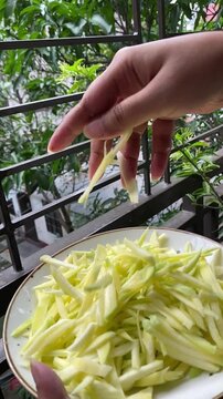peeled mangoes in a bowl. Fresh sweet and sour fruits. Fresh raw green mango ready to be pickled or smashed. fresh young mango and leaf, tropical fruit. mango slice.