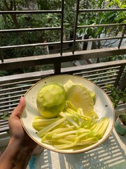 peeled mangoes in a bowl. Fresh sweet and sour fruits. Fresh raw green mango ready to be pickled or smashed. fresh young mango and leaf, tropical fruit. mango slice.