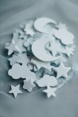Obraz premium Moon, Stars, and Clouds on Light Blue Tulle Background