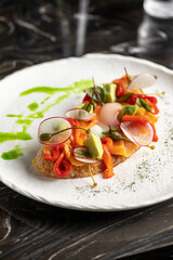 Portion of gourmet bruschetta with salmon and vegetables