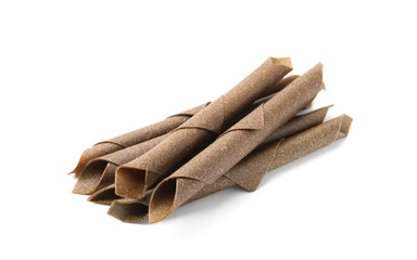 Delicious fruit leather rolls on white background