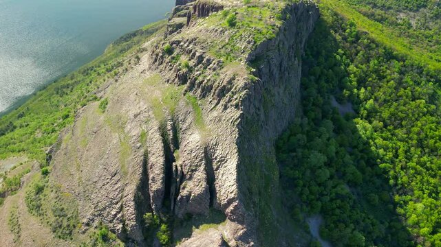 Drone view of the ancient Monyak fortress located on a hill near Kardzhali, Bulgaria. Panoramic view of the ancient Monyak fortress located on a hill on the shore of the dam Studen Kladenets near Kard