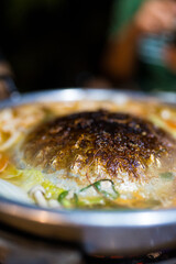 Burnt and dirty pot after eating finish. Thai style cuisine called Moo Ka Ta.