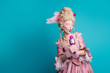 Photo of attractive gorgeous queen wear pompous ruch gown hold mic sing isolated on blue color background