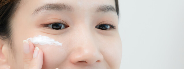 Good skin woman use cream for good skin. face of a healthy woman apply cream and makeup. Advertisement for skin cream, anti-wrinkle, baby face, whitening, moisturizer..