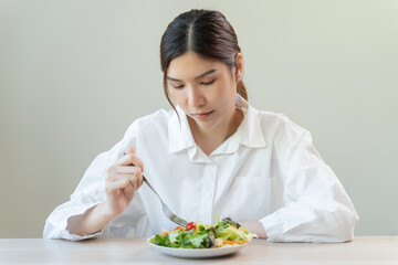 person on diet session feel bored vegetarian meal like salad.