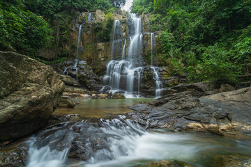 waterfalls in deep forest  National Park ,Kanchanaburi ,A beautiful stream water famous rainforest waterfall in Thailand	
