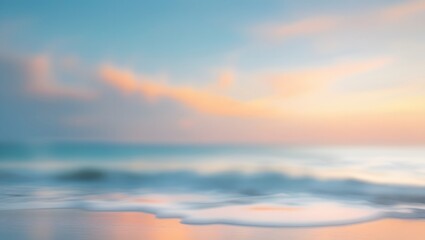 Fototapeta premium Blurred beach sunset scene with soft pastel colors and gentle waves