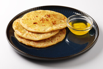 Puran Poli is an Indian sweet flatbread stuffed with chana dal, jaggery, ghee and cardamom and is...