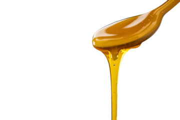 honey dripping from a wooden spoon