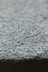 Close up detail of pumice stone texture background. Macro shot of pumice stone
