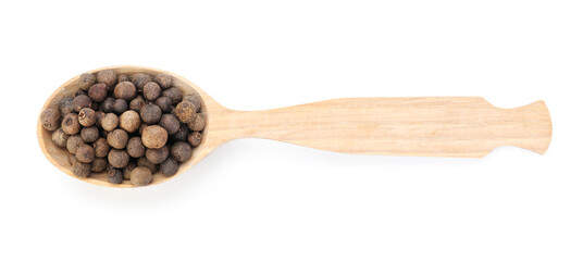 Aromatic allspice in wooden spoon isolated on white, top view